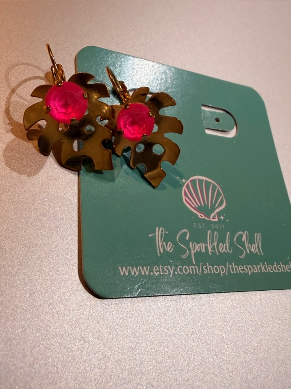EUC Sparkled Shell Gold Palm Leaf Earrings with Hot Pink Gem